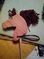 oak stick horse with brown yarn mane