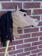 walnut wood stick horse Arabian shape, black mane