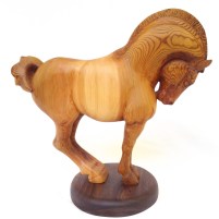 hand carved stylized wood carving of horse on circular walnut stand