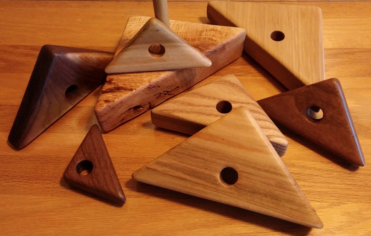 stacking tower of triangles made with reclaimed lumber