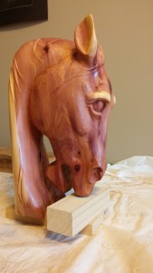 cedar horse head carving side view sanded shellac