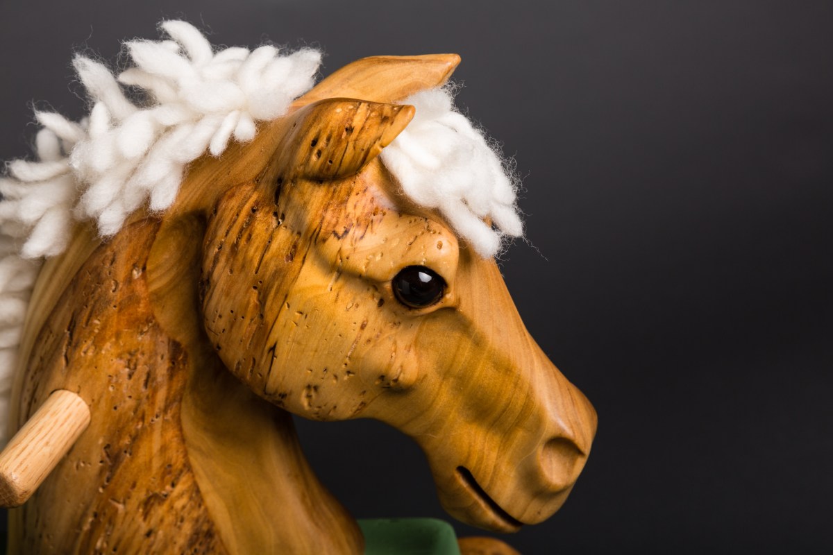 carved reclaimed poplar toddler rocking horse painted green rockers wool mane and tail glass eye