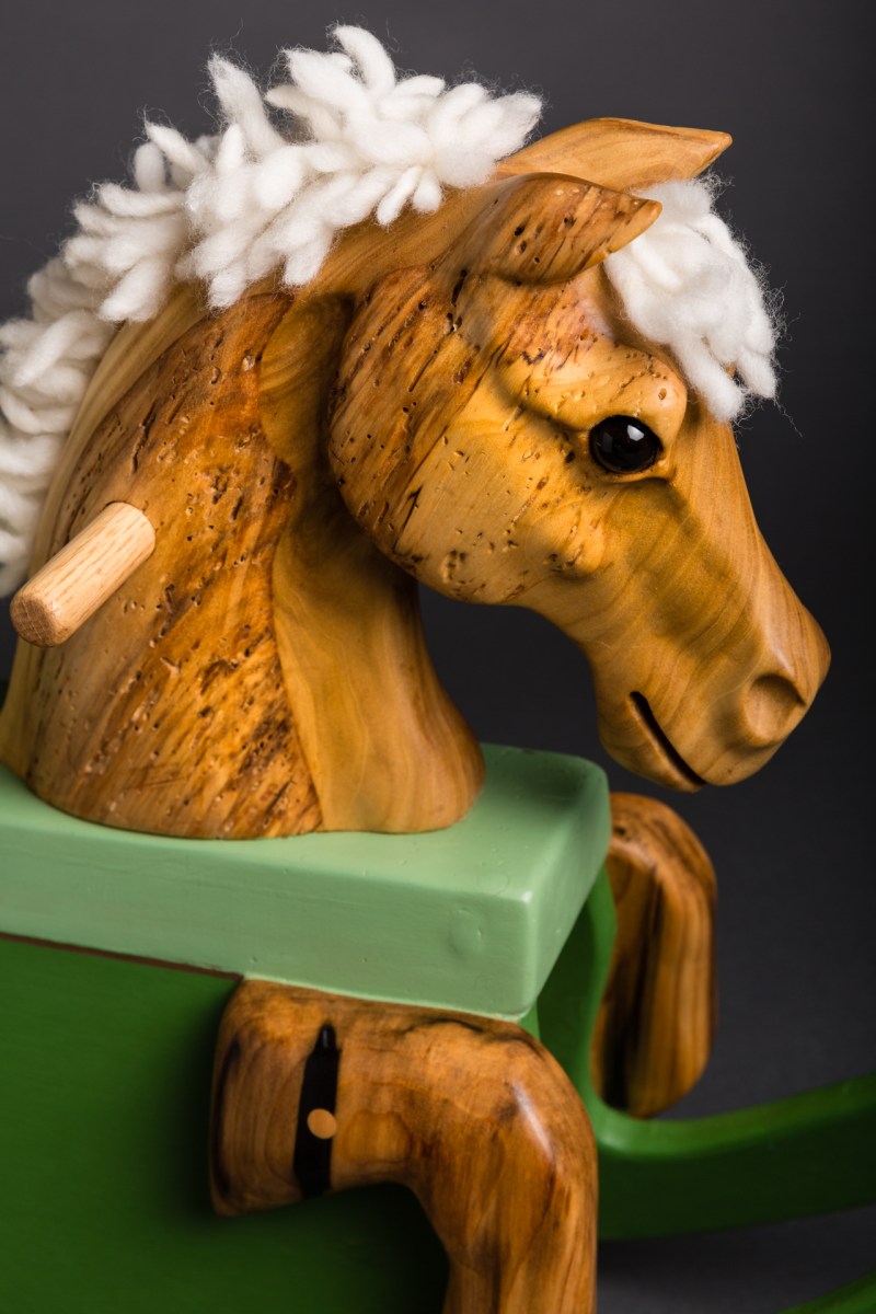 carved reclaimed poplar toddler rocking horse painted green rockers wool mane and tail glass eye