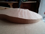angle cut into oak rocking horse leg using trim router and jig
