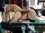 rocking horse made from reclaimed oak standing on grizzly jointer while I work on the rockers