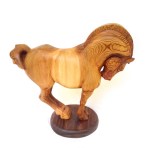 hand carved stylized wood carving of horse on circular walnut stand
