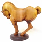 hand carved stylized wood carving of horse on circular walnut stand